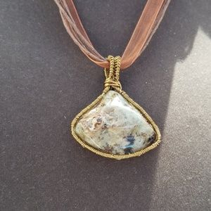 Agate pendant in antique copper wire wrap.